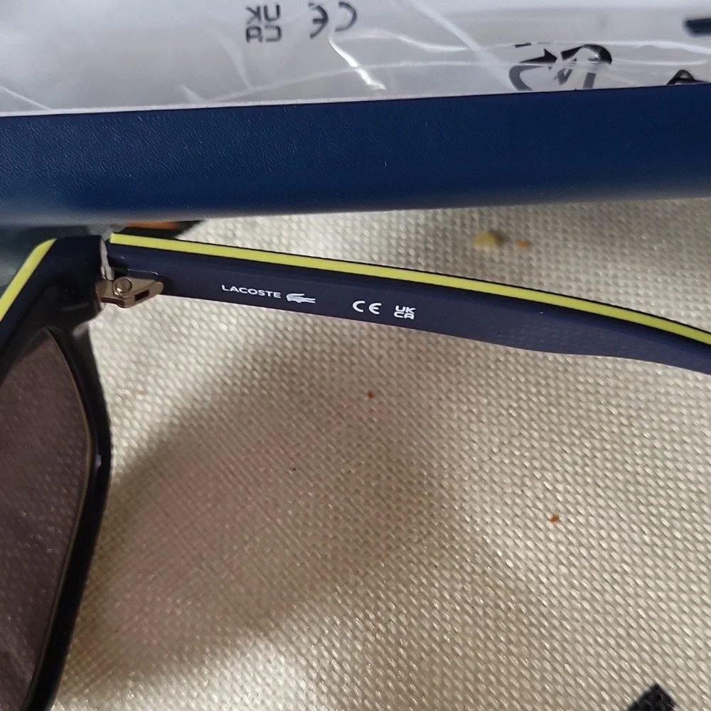Lacoste gorgeous sunglasses dark blue yellow bagged tagged Unisex